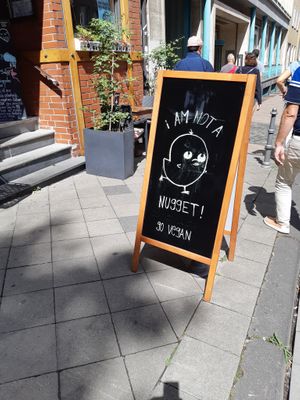 Outside sign promoting veganism at Pfannenzauber in Aachen