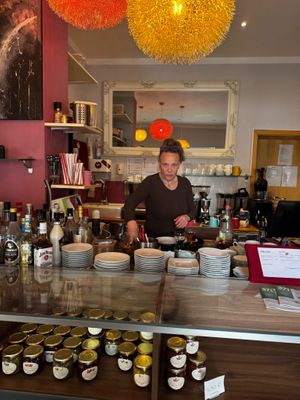 This staff member shouts at customers, mistreats and disrespects immigrants, and handles the inside of boxes even when customers request to pack their own food. at Zoom Cafe & Photo Studio in Chemnitz