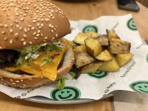 Vegan bacon burger with potatoes  at Foodis in Sant Just Desvern