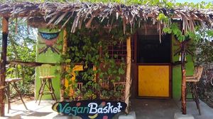 The cute sign can be seen from the road, which is the road directly across from Salty's. at Vegan Basket in Kilifi