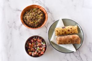 Yellow Bean Curry, Kachumbari (Fresh salsa) and Chapatis (brown and white) at Vegan Basket in Kilifi