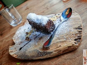 The “Moonie” dessert is a bounty-style bar with a melting vanilla cream topped with pure cocoa icing. at Moon and Sons in Caen