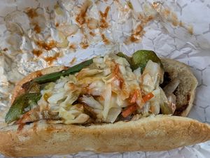 Hotdog with peppers and onions at Plant Based Heat in Memphis