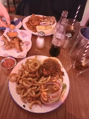 The Vegan Vegfather with curly fries. Side of frickles. Partner had a vegetarian burger with sweet potato fries. at Zaks - Mousehold in Norwich