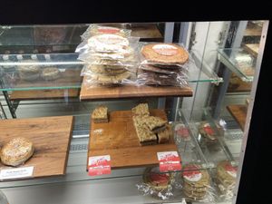 Vegan cake display at Fuego Coffee Roasters in Rochester