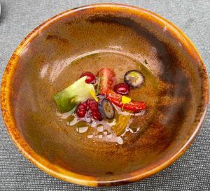 Menu Roof Food zomer 2025 - Amuse: Tomaat - rood fruit - olie van vijgenblad at Yasai Gent  in Ghent