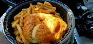 Coltrane croissant sandwich with fries at Mo' Brunch + Brews in Houston