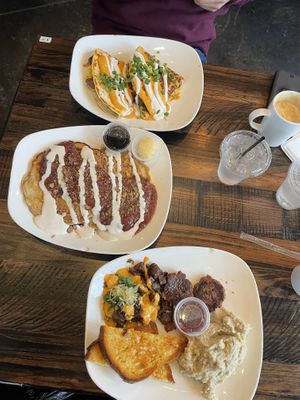 Breakfast quesadilla, strawberry cheesecake pancakes, and the breakfast platter with grits!   at Mo' Brunch + Brews in Houston