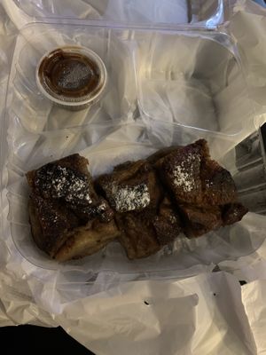 Croissant pudding bread with caramel to go  at Mo' Brunch + Brews in Houston