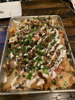 The loaded nachos were huge. The smoked mushrooms tasted like we were at a bbq    at Mo' Brunch + Brews in Houston