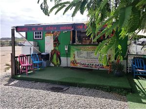 Right on the main drag in Red Hook.  To the right there is a small covered bench if you want to sit and sip.   at Kween Vee Smoothies in St Thomas