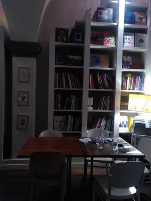 Restaurant tables in the library at Brac Libreria di Arte Contemporanea in Florence