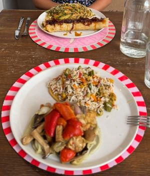 Background: Indian dosa filled with veggies, and spaghetti with a wonderful vegetable sauce. Foreground: rice and veggies, and housemade tempeh and veggies. Extremely fresh tastgan at Brac Libreria di Arte Contemporanea in Florence