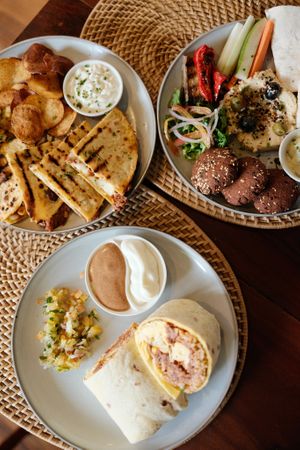 Quesadilla (top left), Mezze Plate (top right), Breakfast Burrito (bottom) at anahaw in Dauin