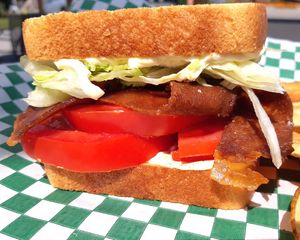 Simple and Bold B.L.T. 
Thick cut Bakun fried golden brown, stacked with Tomatoes, Lettuce, Mayo, a pinch of salt, fresh ground black pepper on toasted thick cut bread. at Chikun Shak in Mount Brydges