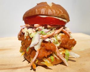 The Wild Buffalo
We cover our specially baked toasted Pretzel bun with a generous coating of Blue Cheeze Dressing then stack on our Buffalo Fried Chikun and top it with our Butterm at Chikun Shak in Mount Brydges