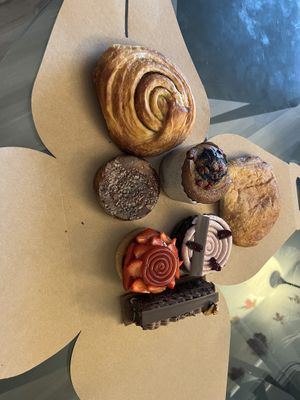 The five items in the middle are from here: Black Forest tart, soufflé, strawberry tart, wownie & brioche crème brûlée. The cinnamon roll and pain su chocolate are from Cafe Tu at Pâtisserie Zébulon in Montreal