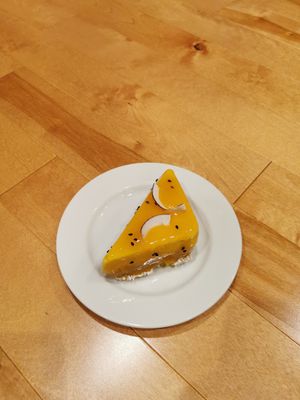 Mango passionfruit coconut cheesecake at Pâtisserie Zébulon in Montreal