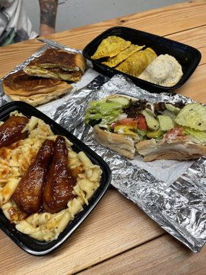 Mac & cheese with bbq ribs, Cuban sandwich, variety of empanadas, chopped cheese at Vegan Bodega in New Britain