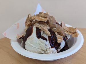 Moose Tracks ice cream topped with Ground Up Waffle Cone nut butter at Kate's Ice Cream in Portland