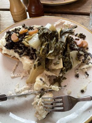 Sourdough toast, cauliflower purée, beluga lentils, chard, pickled plums  at 21 gramm in Berlin