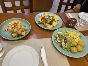 Spring rolls, nachos and falafel plate of the day   at Santo Seitan in Sao Miguel