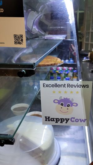 Happy Cow sticker on the display at Santo Seitan in Sao Miguel