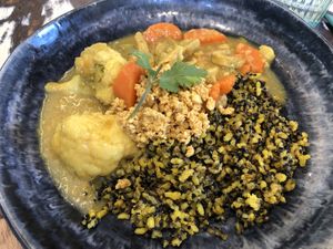Brown rice with cauliflower curry, carrots & heura  at La Mujer de Verde in Mallorca