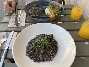 Black rice with mushrooms and truffle sauce, and the mezze platter    at La Mujer de Verde in Mallorca