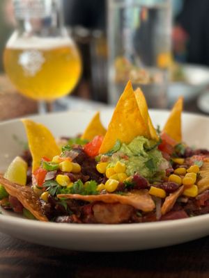 Jackfruit enchilada with tortilla chips, pico de gallo, corn, avocado cream, lime, and coriander.  at La Mujer de Verde in Mallorca