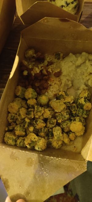 Part of sample platter including fried okra and mash at Souley Vegan in San Francisco