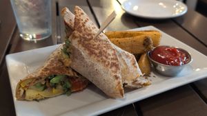 The V Wrap (with the hummus of the day: sriracha carrot) and a side of yucca fries at Wallace's at the Greenhouse in Homosassa