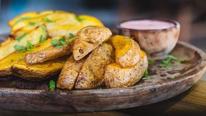 Herbed potato wedges with vegan aioli sauce at Tribearth  in Diani Beach