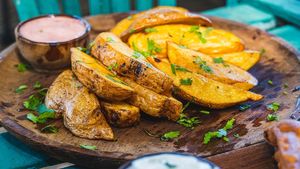 Herbed potato wedges with vegan aioli sauce at Tribearth  in Diani Beach