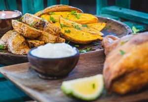 Herbed potato wedges with vegan aioli sauce at Tribearth  in Diani Beach