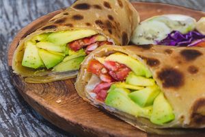 Avocado & tomato chapati wrap. High Fiber Avocado & Tomato Wrap at Tribearth  in Diani Beach