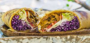 Vegan Beef Shawarma chapati wrap with caramelized onions, salad & vegan garlic mayonnaise at Tribearth  in Diani Beach
