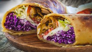 Vegan Beef Shawarma chapati wrap with caramelized onions, salad & vegan garlic mayonnaise at Tribearth  in Diani Beach