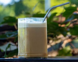 Iced Latte With Oat Milk Served With Homemade Syrup at Tribearth  in Diani Beach
