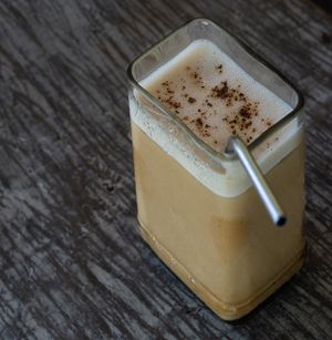 Iced Latte With Oat Milk Served With Homemade Syrup at Tribearth  in Diani Beach