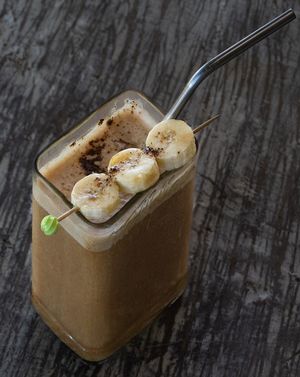 Iced Banana Date Latte. Fresh roasted coffee shot, banana, dates, plant based milk  at Tribearth  in Diani Beach