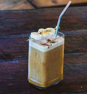 Iced Banana Date Latte. Fresh roasted coffee shot, banana, dates, plant based milk  at Tribearth  in Diani Beach