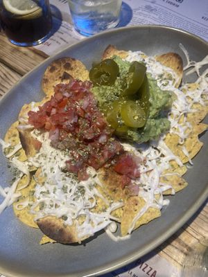 Nachis with vegan cheese, guacamole and salsa  at Disco House Funky Pizza in Palafrugell