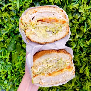 Vegan Turkey Sub stacked with vegan provolone, black olives, lettuce, pepperoncini, red onion, tomato, mayo and vegan honey mustard. Perfect crusty roll #Veganuary at Subvegan Sandwiches in Garden Grove