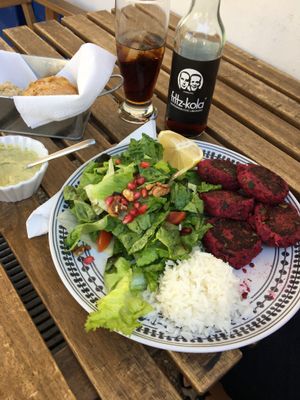 Red beet falafel with fresh salad. (And tasty buns with hummus for starters.) at Inga's Veggie Heaven in Nicosia