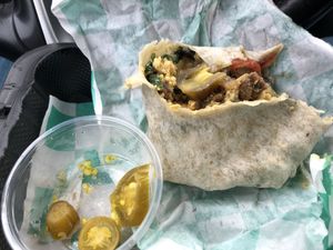 I said that I would take one bite before I take the photo and it was so good that I got carried away. It was a sausage , eggs and peppers burritos. I totally enjoyed it.  at Hue Cafe & Apothecary in Owings Mills