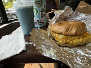 Steak egg and cheese bagel with blue lagoon drink  at Hue Cafe & Apothecary in Owings Mills