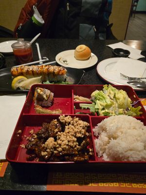 Bbq pork buns, spicy tuna sushi, and crispy beef bento box. at Chef Kenny's Vegan Dim Sum in Las Vegas