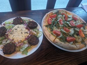 Falafel salad and arabiata pizza at Darkwood - Craft Beer Garden Imaimoze in Mostar
