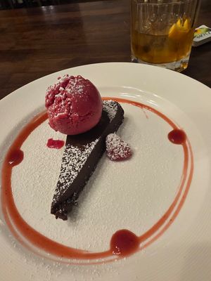 Chocolate tarte with raspberry sorbet at Kingshouse Restaurant in Ballachulish